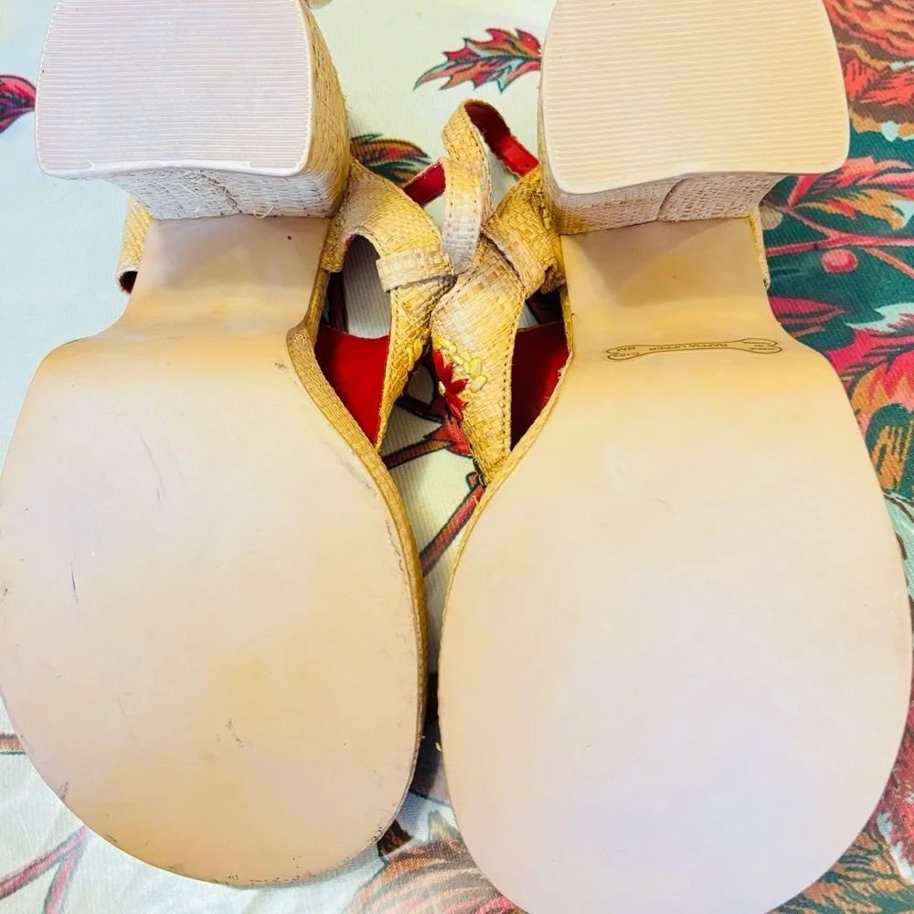 Rocket Dog brand wedges sandals with raffia uppers and floral embellishments.